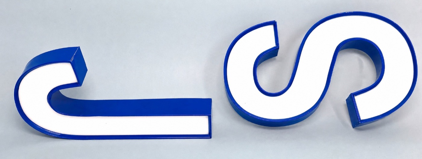Trim-cap channel letters with a visible colored aluminum trim border