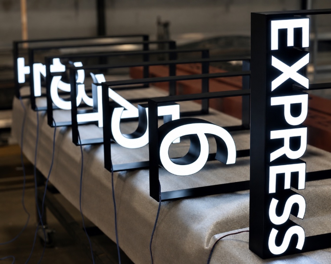Trimless illuminated channel letters with a clean, borderless edge